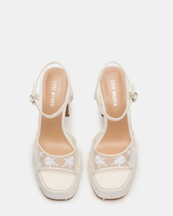 Liandra in rete bianca decorata