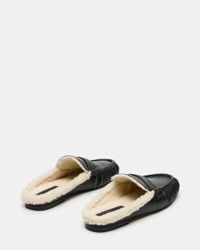 Rafe in pelle nera e pelliccia sintetica